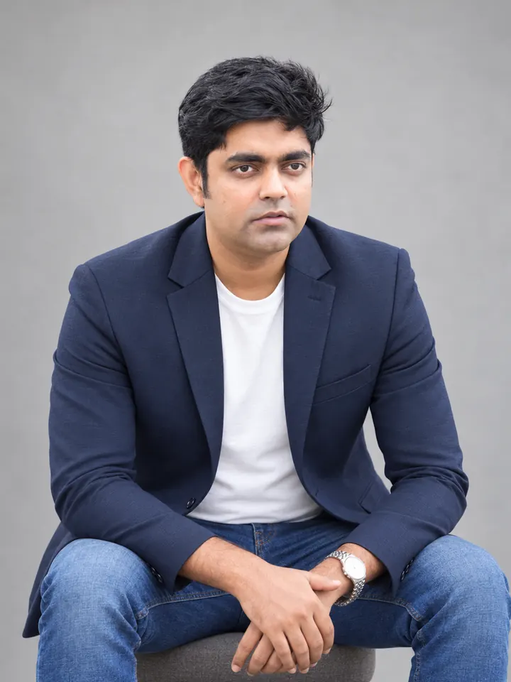Md. Zahirul Islam, seated, in a navy blazer